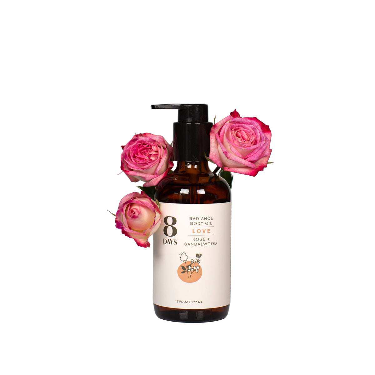 Bottle of 8 Days love body oil with pink roses on a light gray background