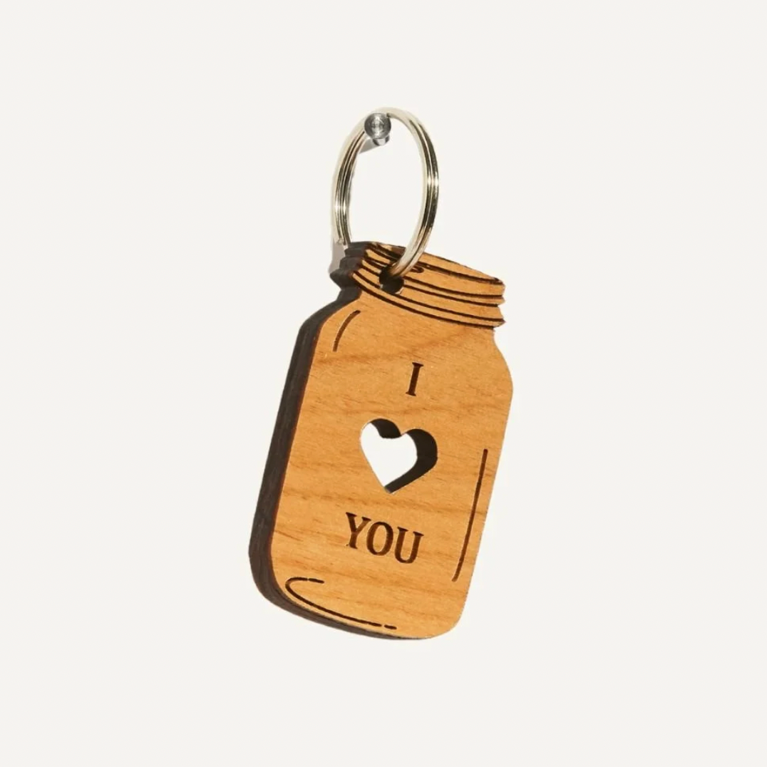 Wooden keychain with 'I ❤️ YOU' engraving on a white background