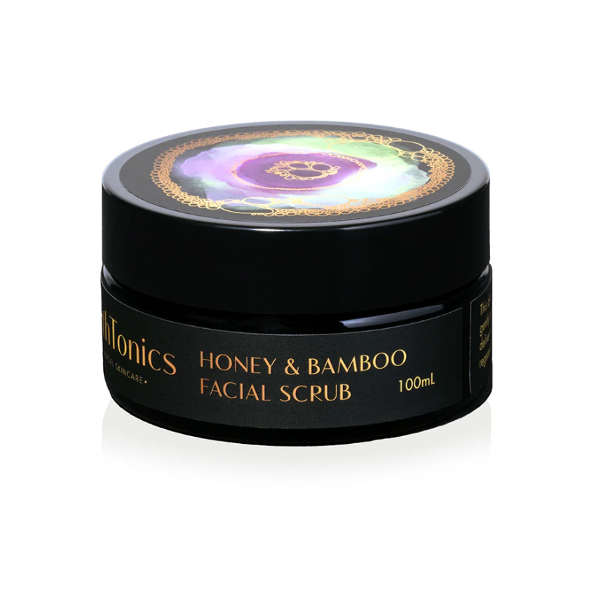 Facial scrub jar labeled 'Honey & Bamboo' on a white background