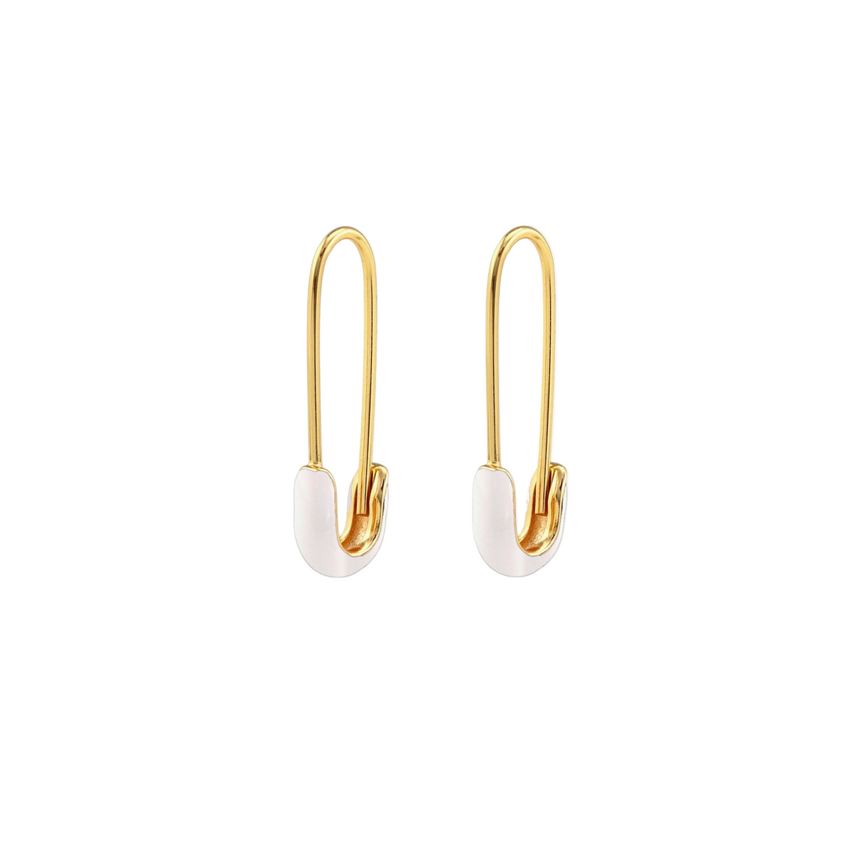 Gold safety pin earrings with white ceramic ends on a white background