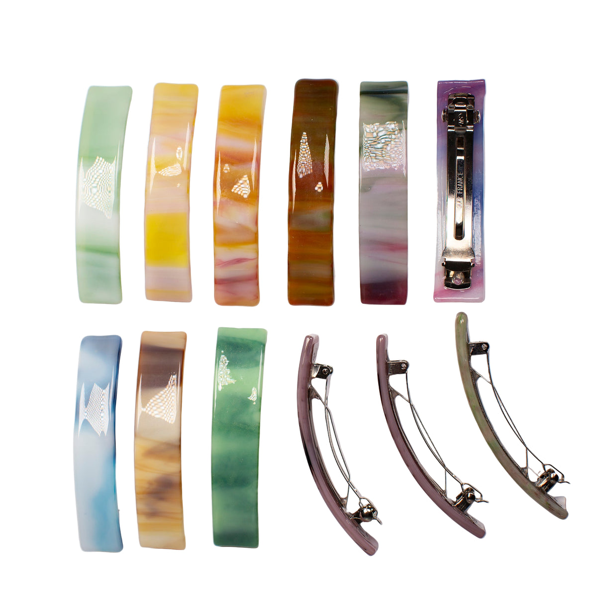 Set of colorful glass hair clips on a white background