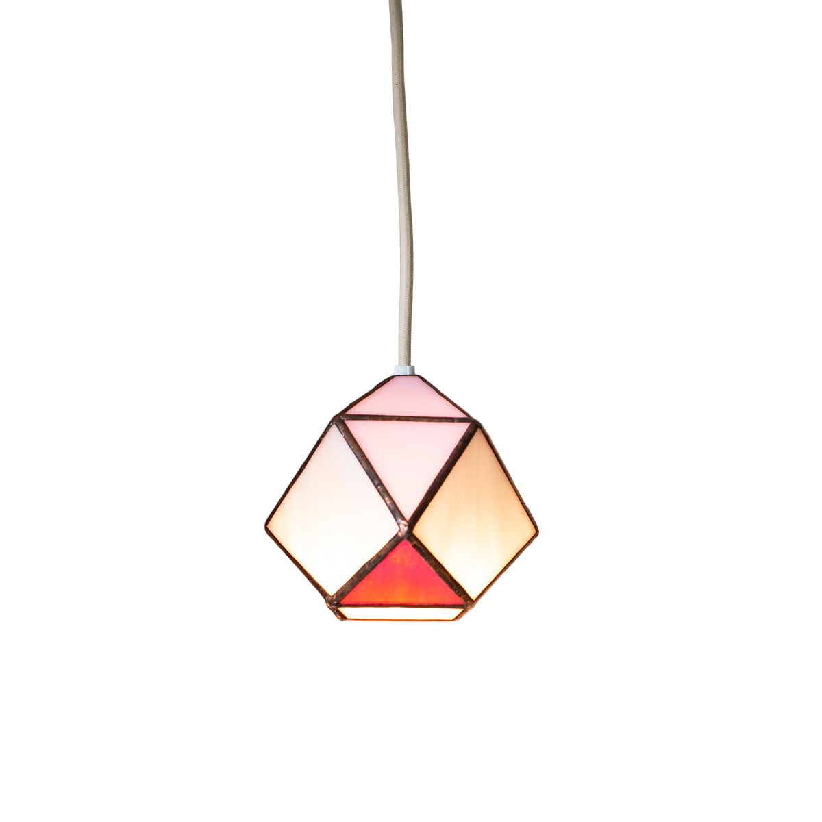 Geometric stained glass pendant light with stained glass design on a white wall background