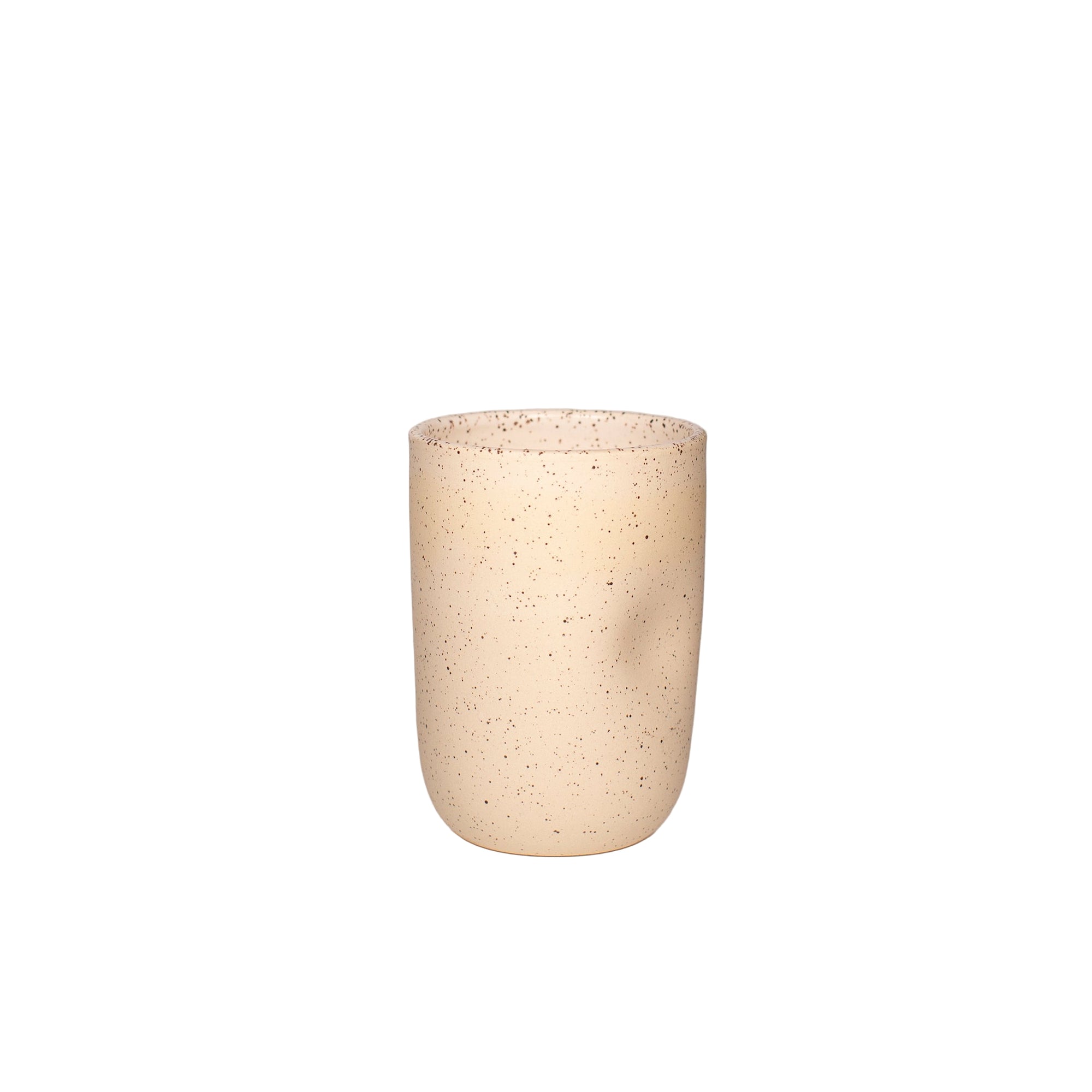 Buff speckled handthrown tumbler with a thumb dimple