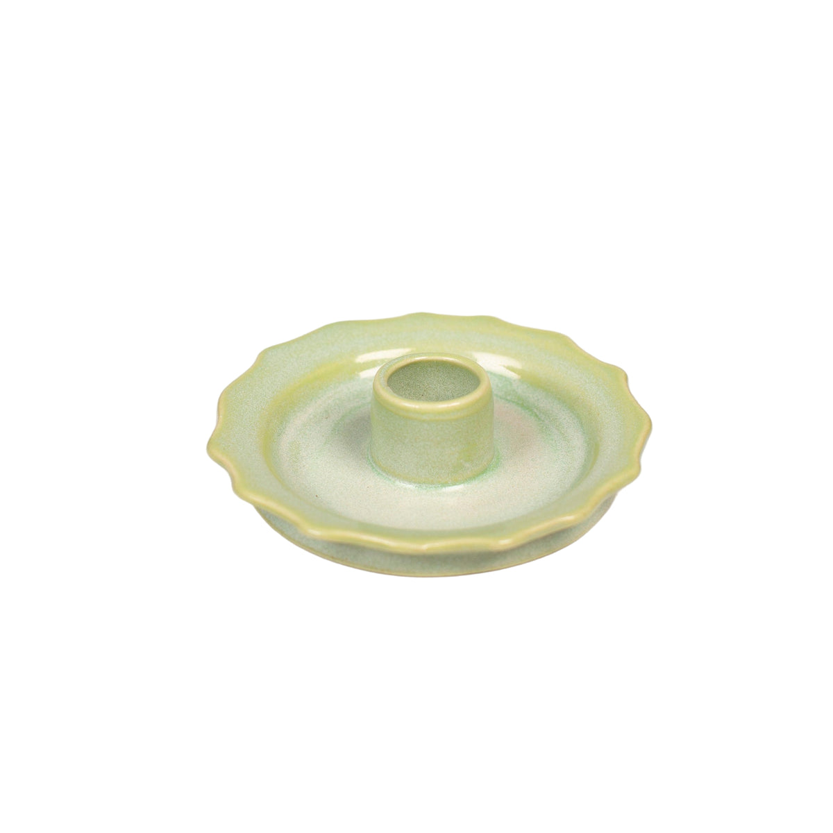 Green ceramic candle holder on a white background