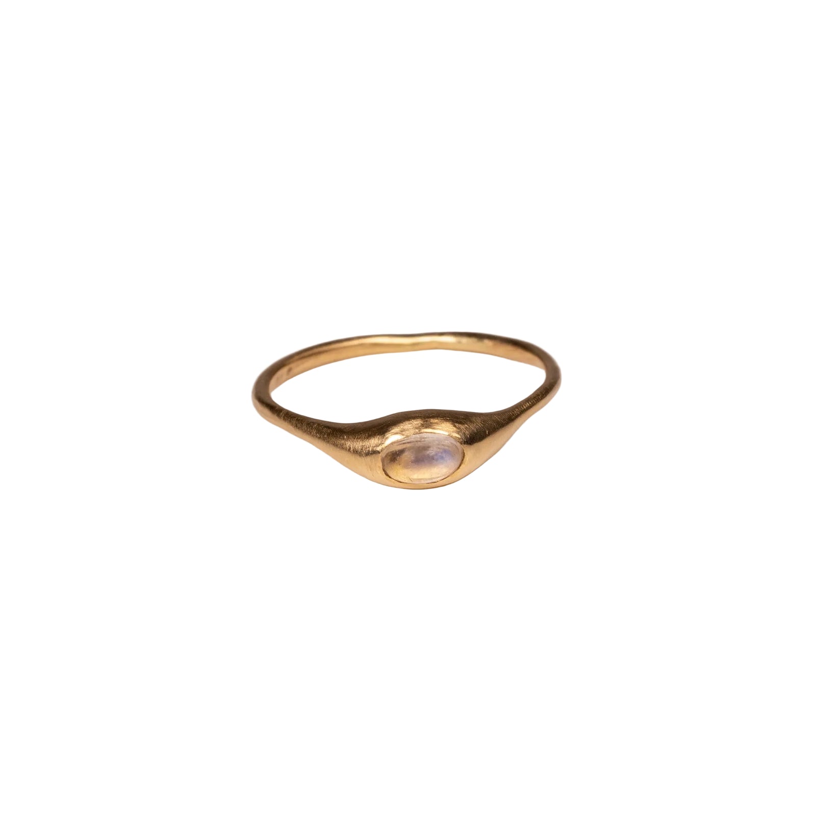 Gold ring with a central moonstone on a white background