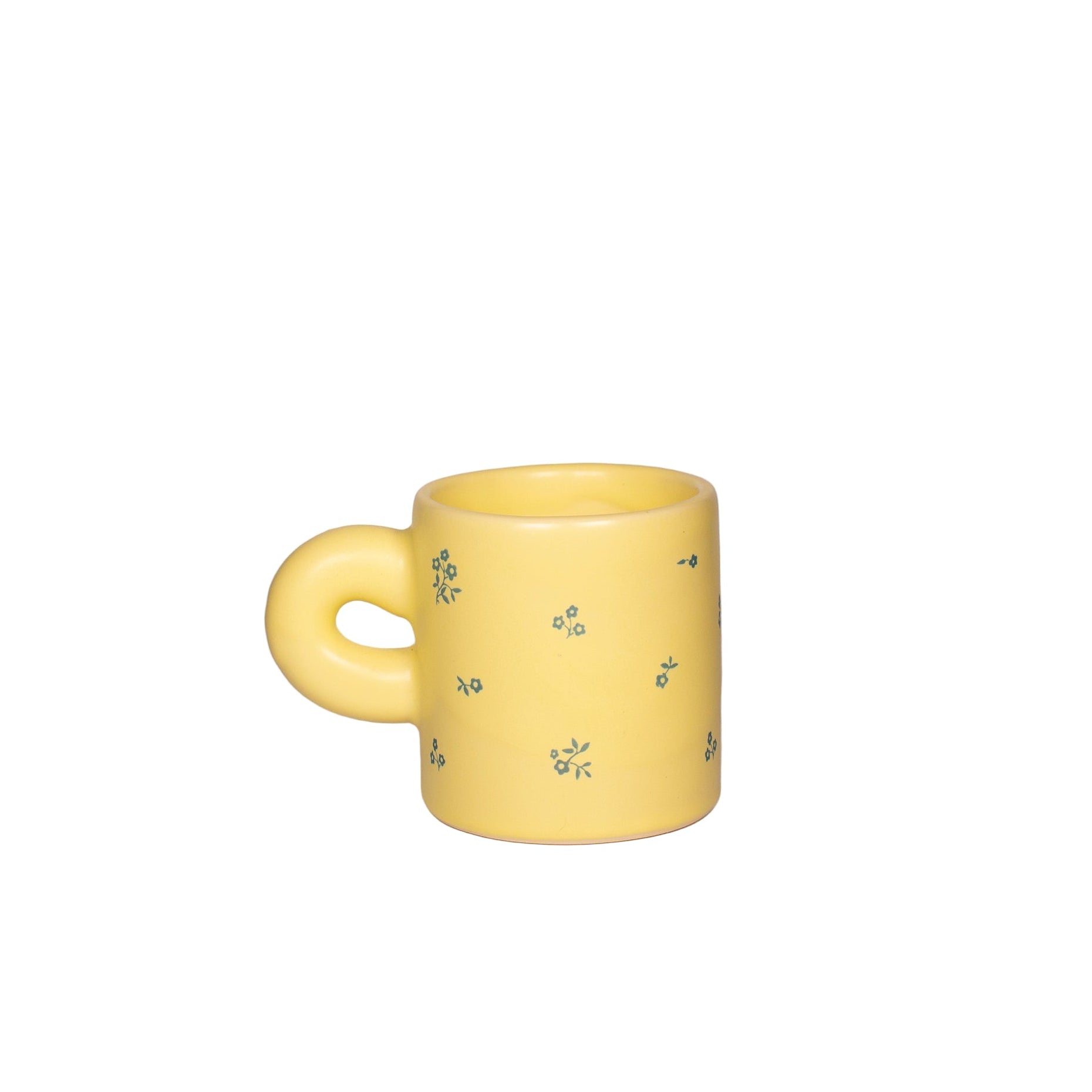 handmade Yellow mug with floral patterns on a white background