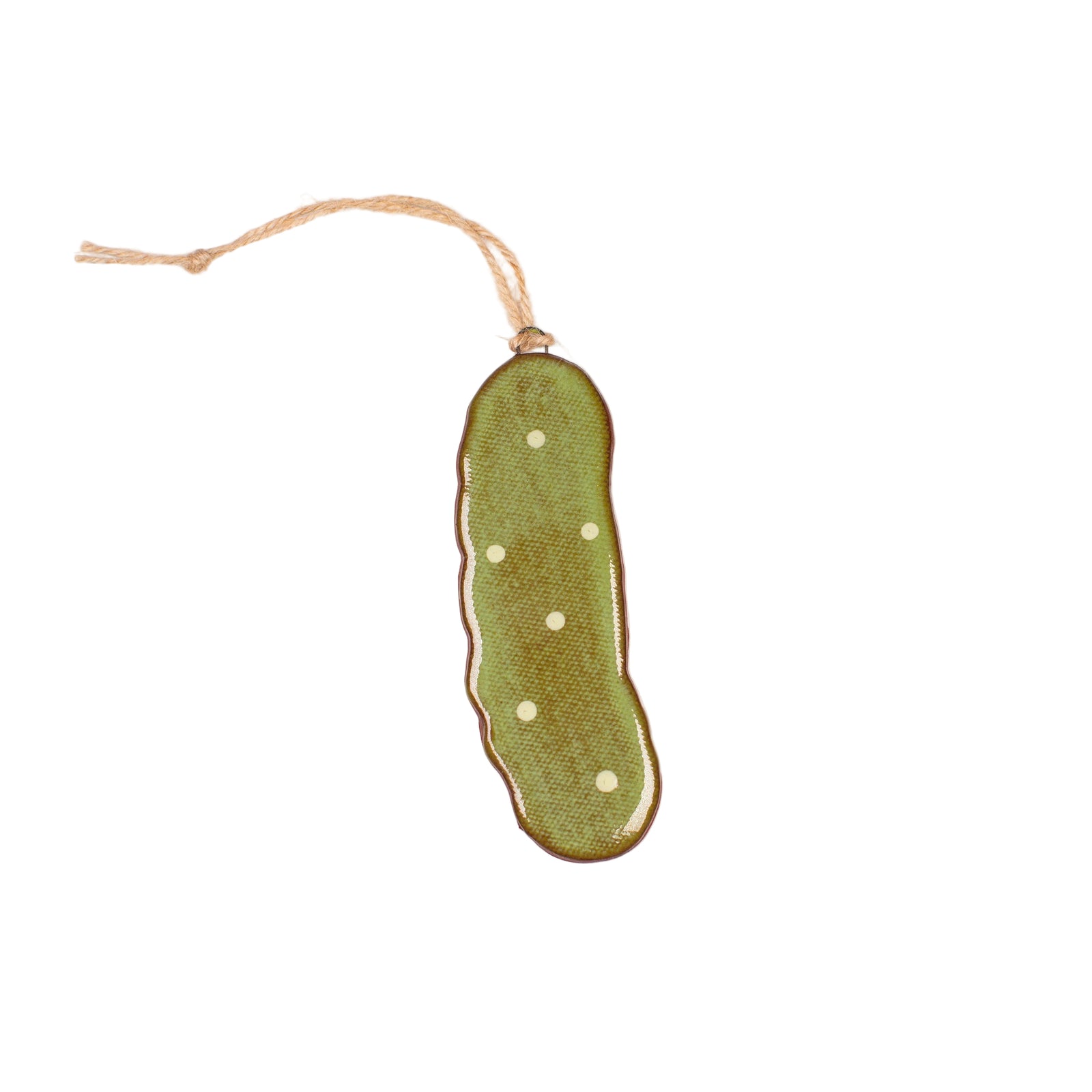 Green pickle-shaped ornament with white spots on a beige background