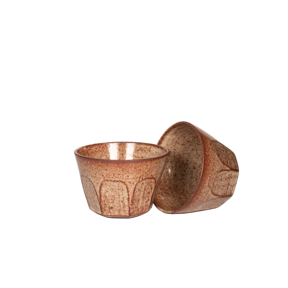 Two ceramic short tumbler cups with a speckled brown glaze on a white background